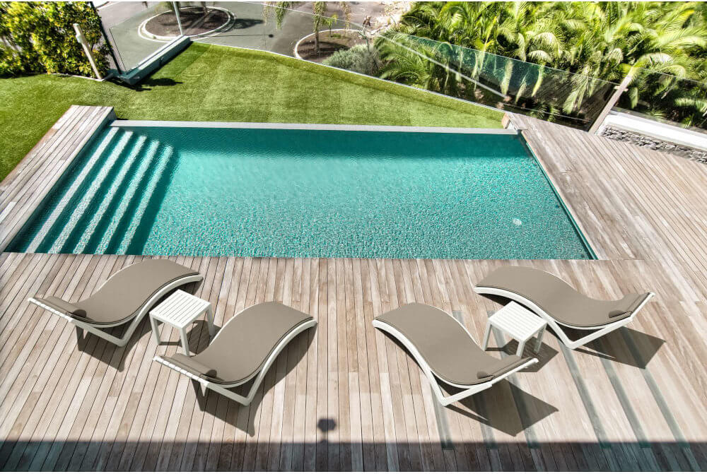 4 slim sunloungers in resort